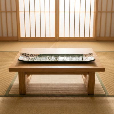 Elegant sushi flower plate on chabudai low table in minimalist Japanese dining room with shoji screens
