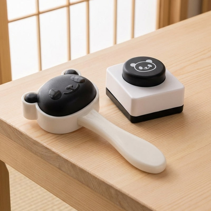 Minimalist sushi rice maker featuring adorable panda motif press on natural wood chabudai table