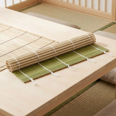 Japanese sushi rolling mat in natural and green bamboo on chabudai low table in traditional tatami room