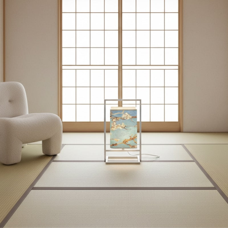 Peaceful table lamp style japanese with cherry blossom pattern on blue shade glowing on tatami mat in minimalist room with large shoji windows