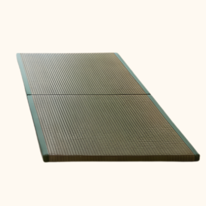 Tatami japanese mat with woven rush surface and green fabric border showing traditional craftsmanship on white background
