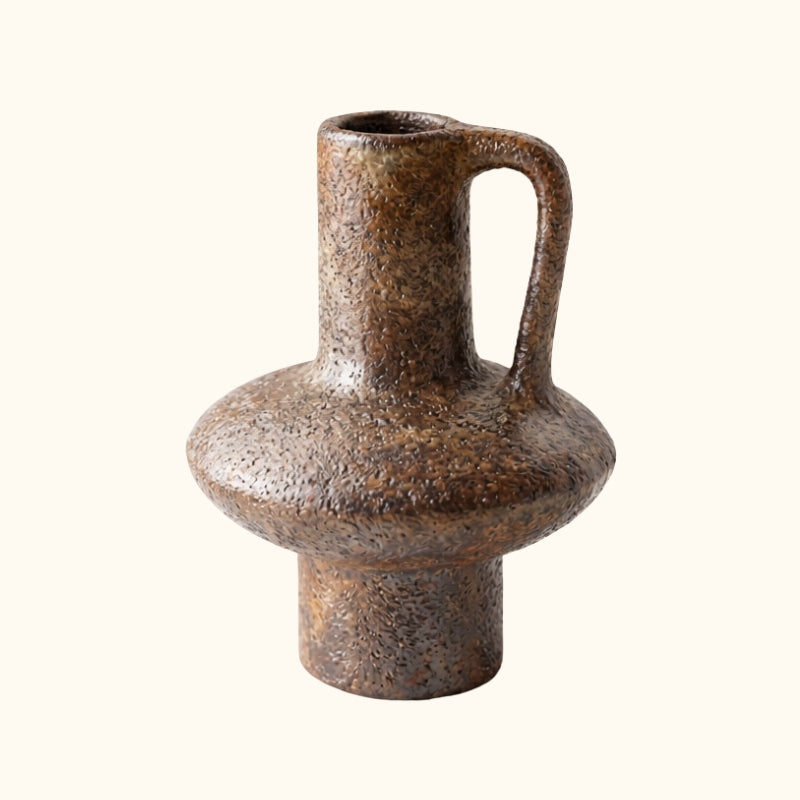Rustic vase wabi sabi long with sculptural handle and organic imperfections on clean white background
