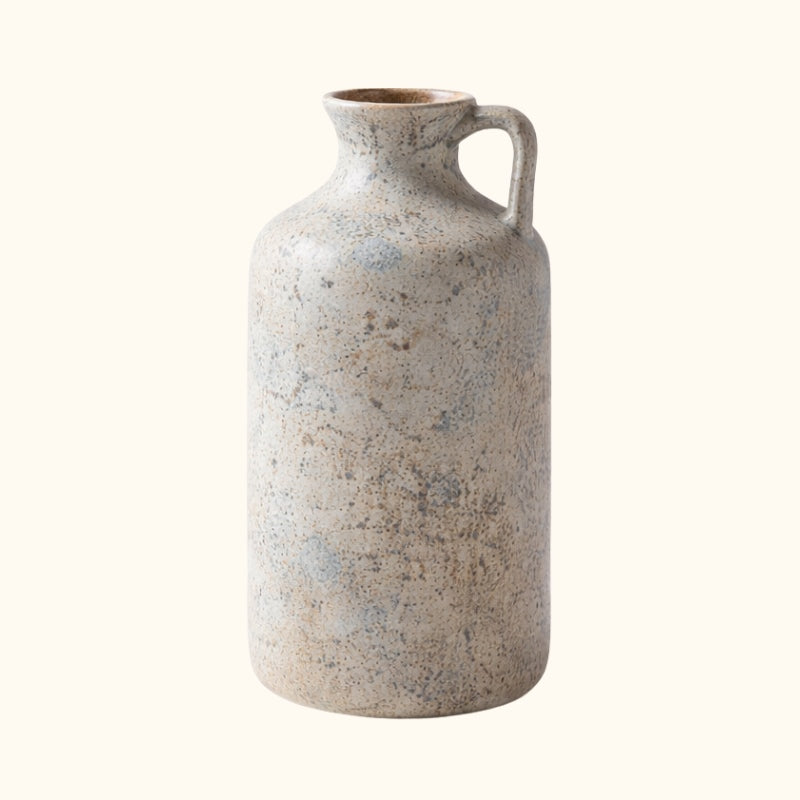 Authentic vintage vase ikebana with handle and natural speckled ceramic finish on clean white background