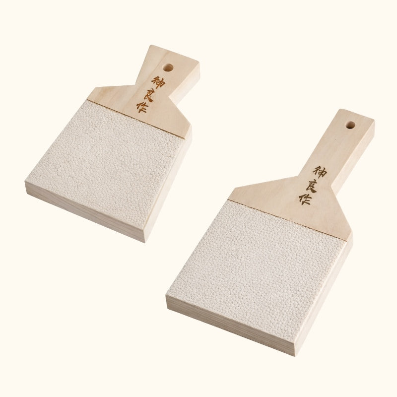 Professional wasabi grinder big and small duo with engraved kanji on clean white background