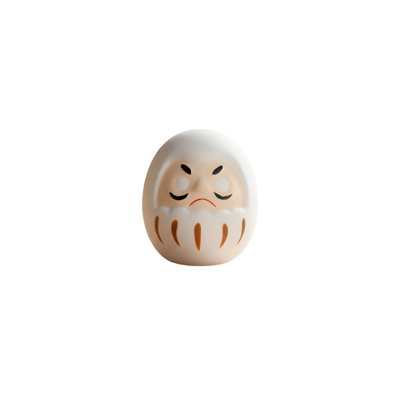 New beginning white japanese daruma in pure ivory finish with blank eyes isolated on clean white background for clear detailed product photography