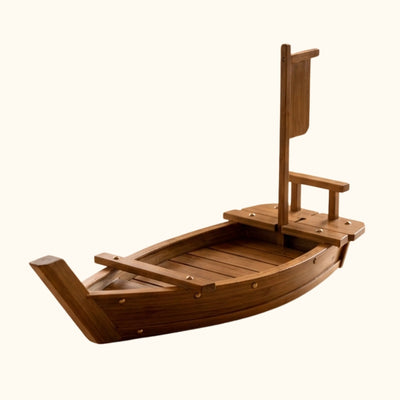 Wood boats sushi serving vessel in dark walnut finish with traditional ship design and vertical mast on white background