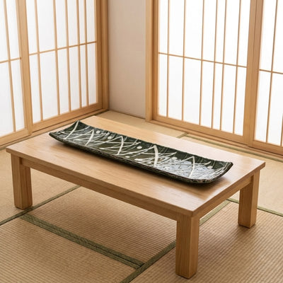Minimalist zigzag sushi plate on tatami floor with shoji paper screens in authentic Japanese interior